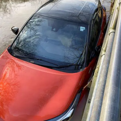 Essex County Fire & Rescue Service A car trapped in flood water