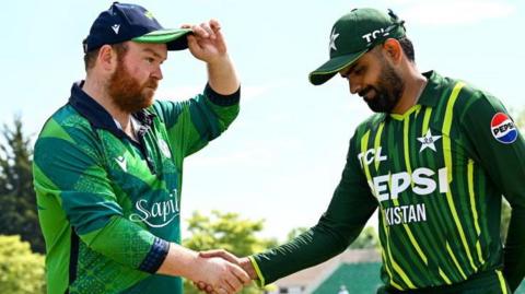 Ireland skipper Paul Stirling shakes hands with Pakistan captain Babar Azam at the start of the current T20 series