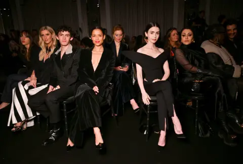 Getty Images for Harris Reed (L to R) Nicky Hilton Rothschild, Joe Locke, Gugu Mbatha-Raw, Lily Collins and Sumayya Vally attend the Harris Reed Autumn / Winter 2026 show during London Fashion Week at Claridge's Hotel on February 19, 2026 in London, England. 