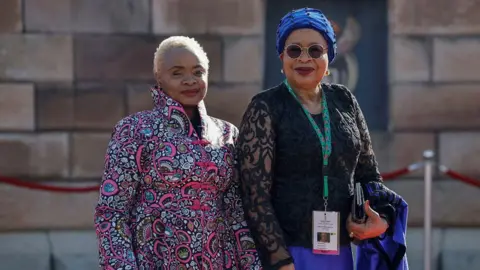 Reuters Graca Machel, widow of former President Nelson Mandela, and her daughter Josina Machel arrive at Ramaphosa's inauguration