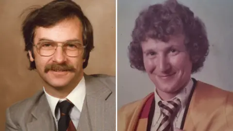 University of Bradford Portrait photograph of two men in the 1980s. The man on the left is wearing a grey striped suit and has brown hair and glasses. The man on the right is wearing graduation robes and had curly hair.