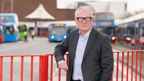 Labour Photograph of Richard Parker at a bus station