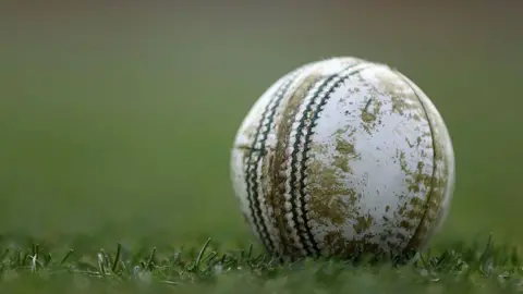 Getty Images A close up picture of a cricket ball on grass