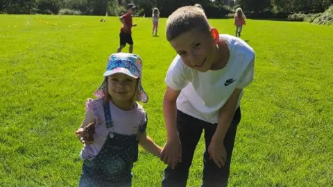 Supplied Ruby is pictured with Harry on a field