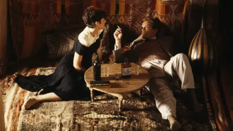 Getty Images Debra Winger and John Malkovich on the set of The Sheltering Sky