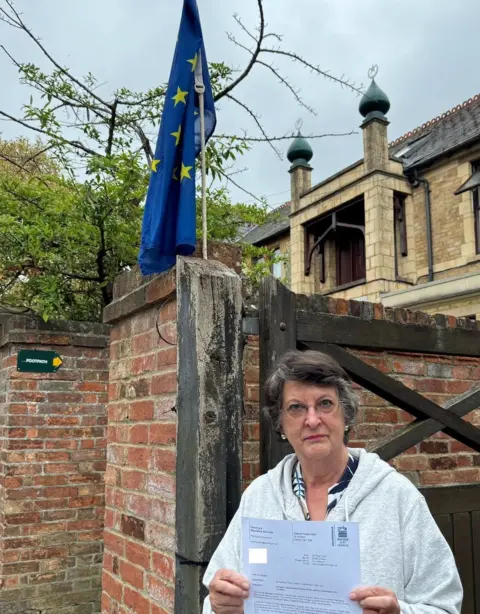 BBC Catherine Bearder outside home with European Flag