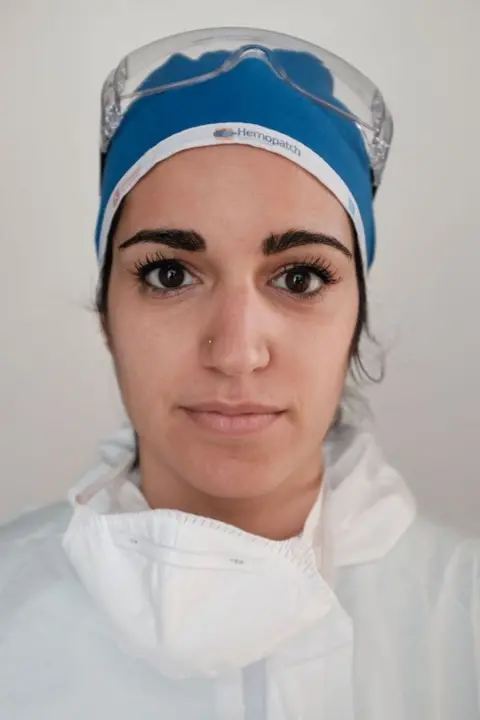 Paolo Miranda A nurse in her medical PPE