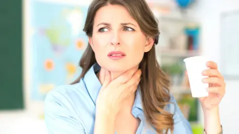 Getty Images woman sore throat