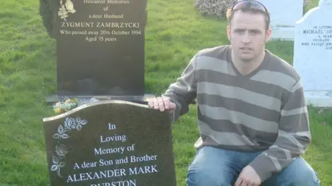 Daniel Durston Daniel Durston kneels by his brother Alex's grave