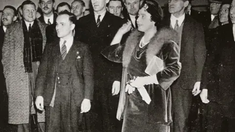 Segro Queen Elizabeth, the Queen Mother plays darts