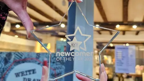 Suddenly in Sheaf Street Clear star-shaped plaque showing newcomer of the year