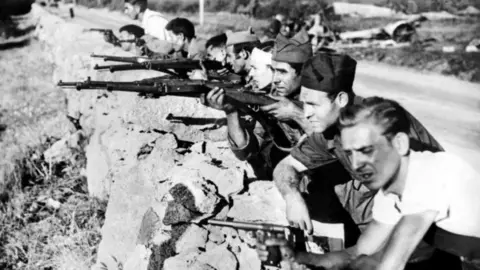 AFP/Getty Republicans fighting on an unidentified road