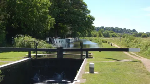 Narrowboats in the Godalming Navigations Conservation Area along the river Wey.