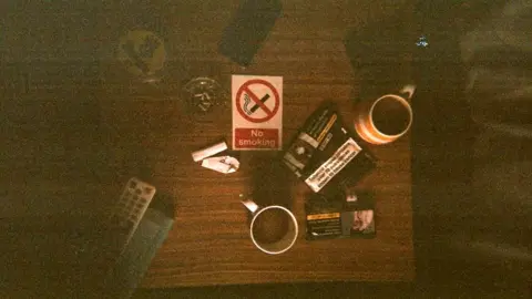 Homeless Oxfordshire A birds-eye view of a table with mugs and cigarettes on it