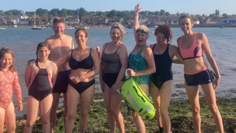 Laura Lennox swimmers in Suffolk having swam over from Essex