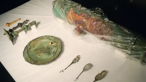 EPA Cutlery and a plate discovered in the shipwreck of the Nuestra Senora de las Mercedes.