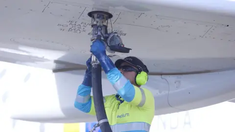 Getty Images An operator fuels an aircraft with sustainable aviation fuel at San Pablo airport, on November 24, 2022 in Seville