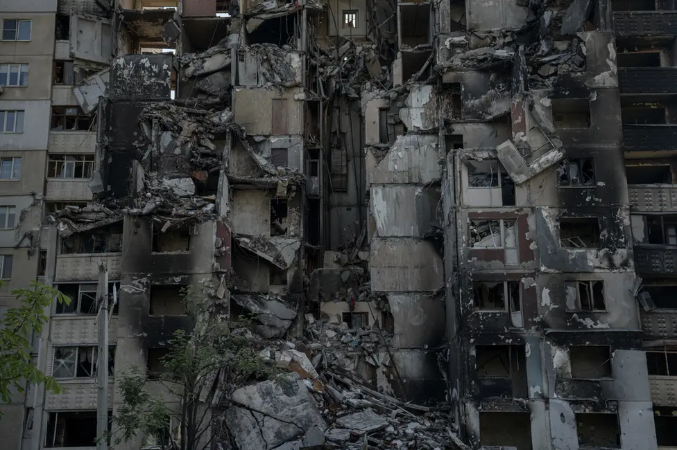 BBC The remains of what was an apartment block in Saltivka. Everywhere you look, there is destruction