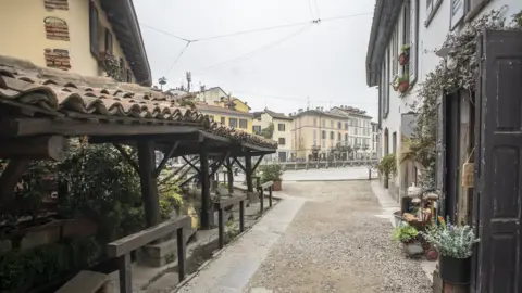 Getty Images The bars and cafes in Milan's Navigli district may not be bustling for now, but by 2025 smoking will be banned here too