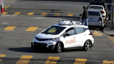 Reuters A Cruise car with cameras on its roof on the street in San Francisco