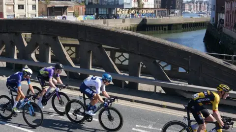 Tour of Britain Cyclists crossing a bridge over River Orwell in Ipswich