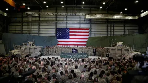 Reuters US President Donald Trump addresses US troops during an unannounced visit to Bagram air base in Afghanistan in November 2019