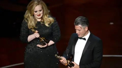 Getty Images Paul Epworth and Adele at the 2013 Academy Awards