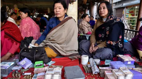 Getty Images Manipuri women run their business in Ima Market in Imphal, Manipur, India on 23 November, 2018. A market exclusively run by women it is called the Ima Market or the Mothers.