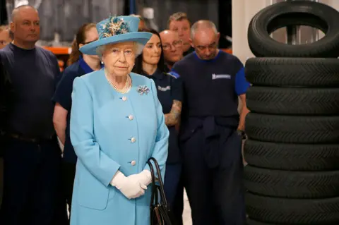 PA Media Queen Elizabeth II meets apprentices during a visit to the training school and workshop at the Michelin tyre factory in Dundee.