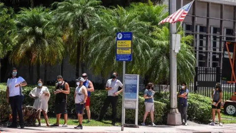 AFP People wait to be tested in Florida