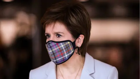 Jeff J Mitchell Former first minister Nicola Sturgeon wearing a face mask during the pandemic
