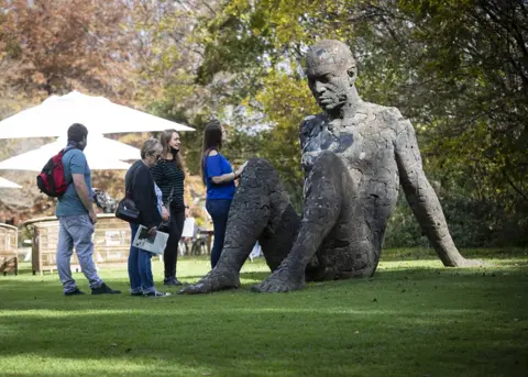 EPA An artwork by artist Daniel Grey is part of the "Good Neighbours" sculpture exhibition at Nirox Sculpture Park in Johannesburg, South Africa, 07 May 2022. Nirox has partnerships with Universities in South Africa, Zimbabwe, Eswatini, Mozambique, Namibia, Angloa and Botswana.