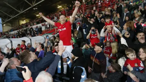 Reuters Paul Mullins celebrates with fans