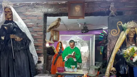 BBC Daniel Santana's Sunday holds a service at a Santa Muerte temple.