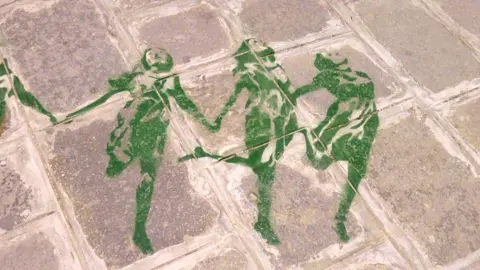Michael Salander Figures painted on a pavement