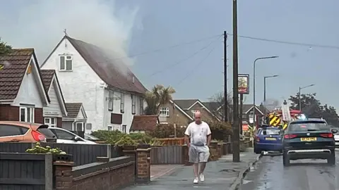 Carly Nash Smoke coming from a roof in Essex