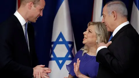 Reuters Prince William speaks to Israeli Prime Minister Benjamin Netanyahu and his wife Sara