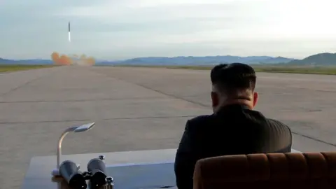 KCNA Kim Jong-un watches the launch of a Hwasong-12 missile (September 2017)