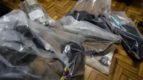 EPA Photograph of weapons seized from Guilherme Taucci Monteiro and Luiz Henrique de Castro, authors of a massacre at a school in Sao Paulo, Brazil, 13 March 2019