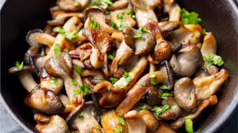 Getty Images Fried mushrooms in a pan