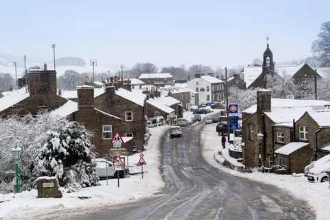 Alamy Live News A snowy street in the town of Hawes in the Yorkshire Dales