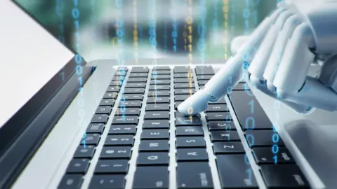 Getty Images Robotic hand on keyboard