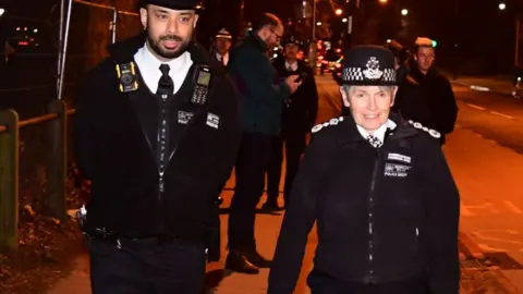 PA Media Dame Cressida Dick joins police officers at Clapham Common as part of reassurance patrols