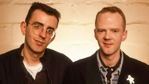 Getty Images Two men, Richard Coles and Jimmy Sommerville, wearing black tops.