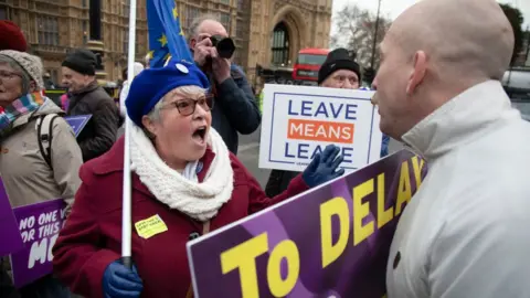 Getty Images Pro- and anti-Brexit demonstrators argue outside Parliament in London