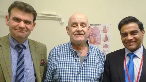 ABMU Health Board Peter Maggs (centre) with Thomas Bragg (left) and Ira Goldsmith