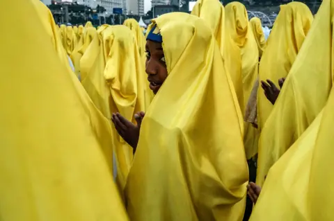 AFP People dressed in yellow