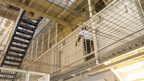 Getty Images Prison officer in jail