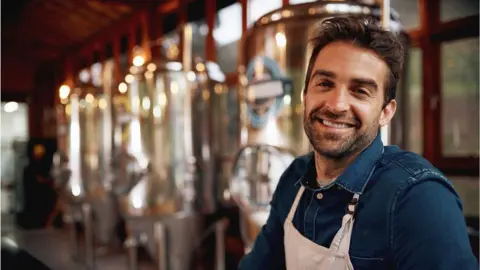 Getty Images Man working in distillery