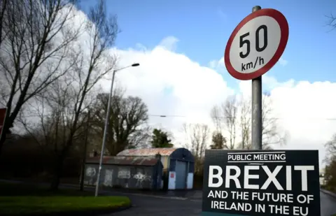 Reuters A former customs hut is seen behind a Brexit sign between Donegal in the Republic of Ireland and Londonderry in Northern Ireland at the border village of Muff, in February 2018